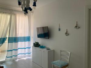 TV a/nebo společenská místnost v ubytování Appartamento Centro del Porto