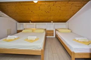 Llit o llits en una habitació de Vila Maria Old Town Hvar