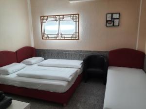 Cama o camas de una habitación en Hotel Ko