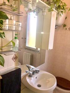 a bathroom with a sink and a mirror at Casa Patti alle porte di Siena in Siena +50 photos