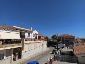 a view of a street in a city with buildings at Monísimo Pensión Rincón de la Victoria in Rincón de la Victoria