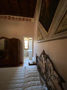 Posteľ alebo postele v izbe v ubytovaní Palazzo Forlani