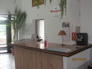 an office with a reception counter with a desk at Fregata in Wilkasy