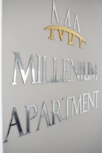 a sign that reads a million dollar restaurant and a sign that says a million premier at Millenium apartment in Soko Banja