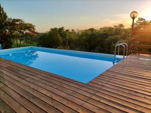 a swimming pool on the roof of a house at Le Mimose B&B in Vinci