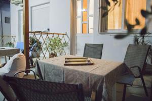 a table in a room with chairs and a window at Villa Georgia in Potos +22 photos