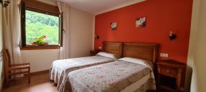 Postel nebo postele na pokoji v ubytování Apartamentos La Corona - Cabrales