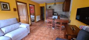 A kitchen or kitchenette at Apartamentos La Corona - Cabrales