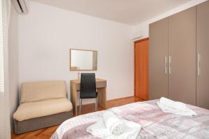 Postel nebo postele na pokoji v ubytování Apartman Marjeto