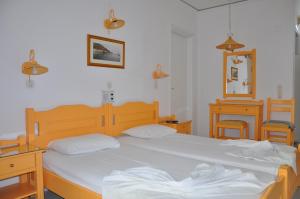 Postel nebo postele na pokoji v ubytování Remezzo Hotel & Studios