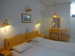 Postel nebo postele na pokoji v ubytování Remezzo Hotel & Studios