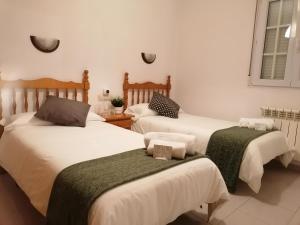 A bed or beds in a room at Albergue Cervera de Pisuerga