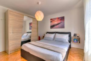 a bedroom with a large bed in a room at Holiday house KIM in Kali