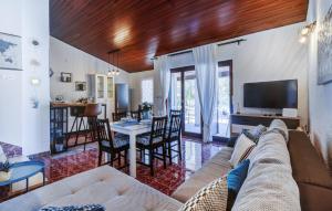 a living room with a couch and a table at Holiday house KIM in Kali