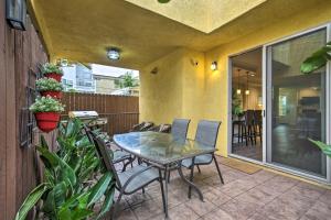 a patio with a table and chairs on a balcony at Sunny SoCal Hideaway Less Than 2 Miles to Pacific Beach! in San Diego