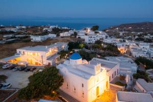 an aerial view of a town at night at The Be House in Sifnos