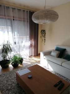 a living room with a couch and a coffee table at Sea & City in Leça da Palmeira