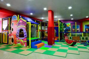 a childrens play room with a slide and a playground at Golden Lili Resort & Spa in Aley