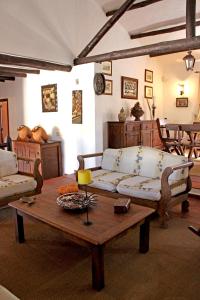 a living room with a couch and a coffee table at Monte Pinheiro in Rabaços