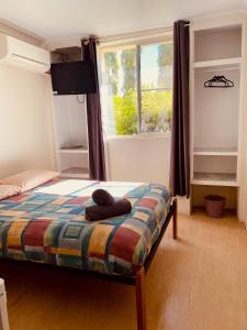 Un pat sau paturi într-o cameră la Accommodation @ Isa