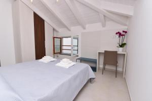 Ένα ή περισσότερα κρεβάτια σε δωμάτιο στο SoleLuna Agerola