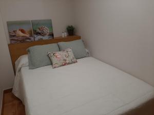 Ένα ή περισσότερα κρεβάτια σε δωμάτιο στο Bonito apartamento en O Grove