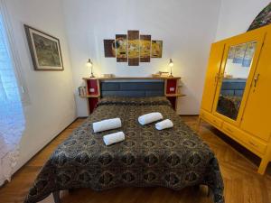 a bedroom with a bed with two towels on it at Suite Semeria 38 - Sanremo in Sanremo