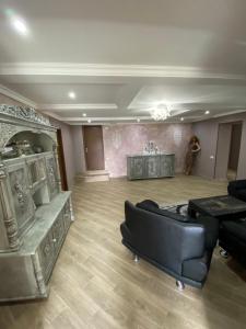 a living room with a couch and a table at ART HOUSE 33 in Kutaisi