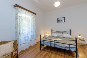 Postel nebo postele na pokoji v ubytování Apartments Štefi 869