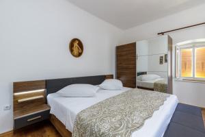 Postel nebo postele na pokoji v ubytování Apartments Štefi 869