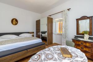 Postel nebo postele na pokoji v ubytování Apartments Štefi 869
