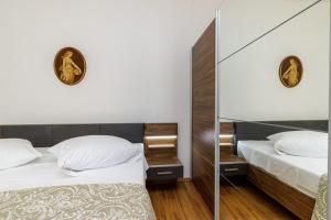 Postel nebo postele na pokoji v ubytování Apartments Štefi 869