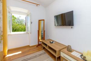 TV a/nebo společenská místnost v ubytování Apartments Štefi 869