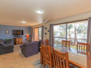 a living room with a table and chairs at Aranda 3 25 Townsend Street in Jindabyne