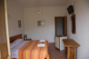 Postel nebo postele na pokoji v ubytování Hotel-Pensione 4 Stagioni