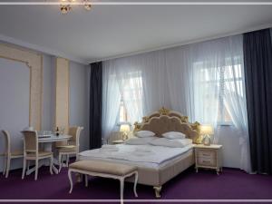 Łóżko lub łóżka w pokoju w obiekcie Perla