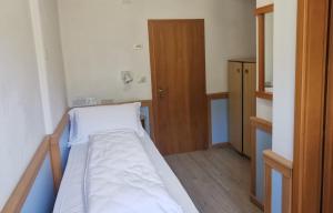 Postel nebo postele na pokoji v ubytování Hotel Miramonti