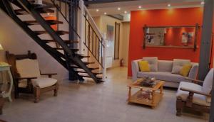 Uma área de estar em Don Pepe Hotel y Cabañas
