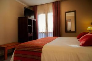 Cama ou camas em um quarto em Don Pepe Hotel y Cabañas