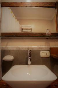 Um banheiro em Don Pepe Hotel y Cabañas