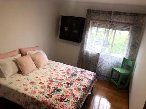 Una cama o camas en una habitación de Casa Divino Salvador