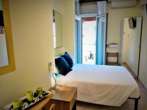 Postel nebo postele na pokoji v ubytování Le Petit Hotel