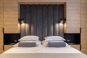 Postel nebo postele na pokoji v ubytování Luxury rooms Unicus I, II, IV