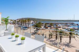 a balcony with a view of a marina at MEVAMAR in Fornells