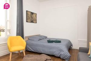 Llit o llits en una habitació de Le Karijini - Hyper Centre, Poitiers