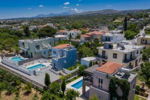 an aerial view of a house with a swimming pool at Aphrodite in Adelianos Kampos