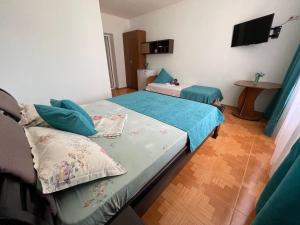 Postel nebo postele na pokoji v ubytování Hotel NATALI + 37 fotografií