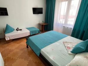 Postel nebo postele na pokoji v ubytování Hotel NATALI