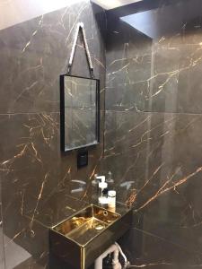 Kúpeľňa v ubytovaní Gold Box Apartament