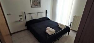 Postel nebo postele na pokoji v ubytování Via Pisa 20